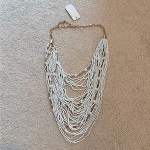 Elegant Multi-Strand White Beaded Necklace with Gold Chain